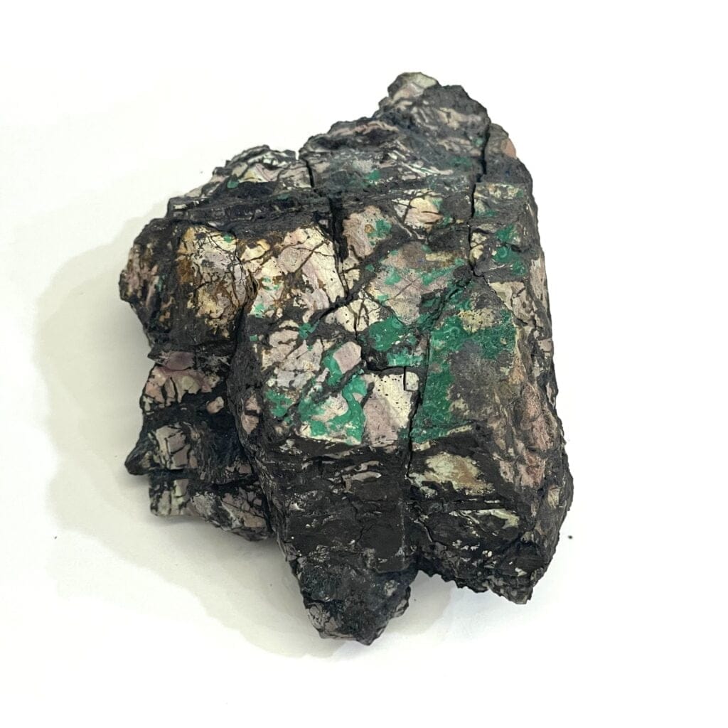 A rough mineral rock with dark, cracked surfaces and green and light patches, featuring Beautiful Malachite on Matrix with Secret Azurite Crystal from the Morenci, AZ Mine.