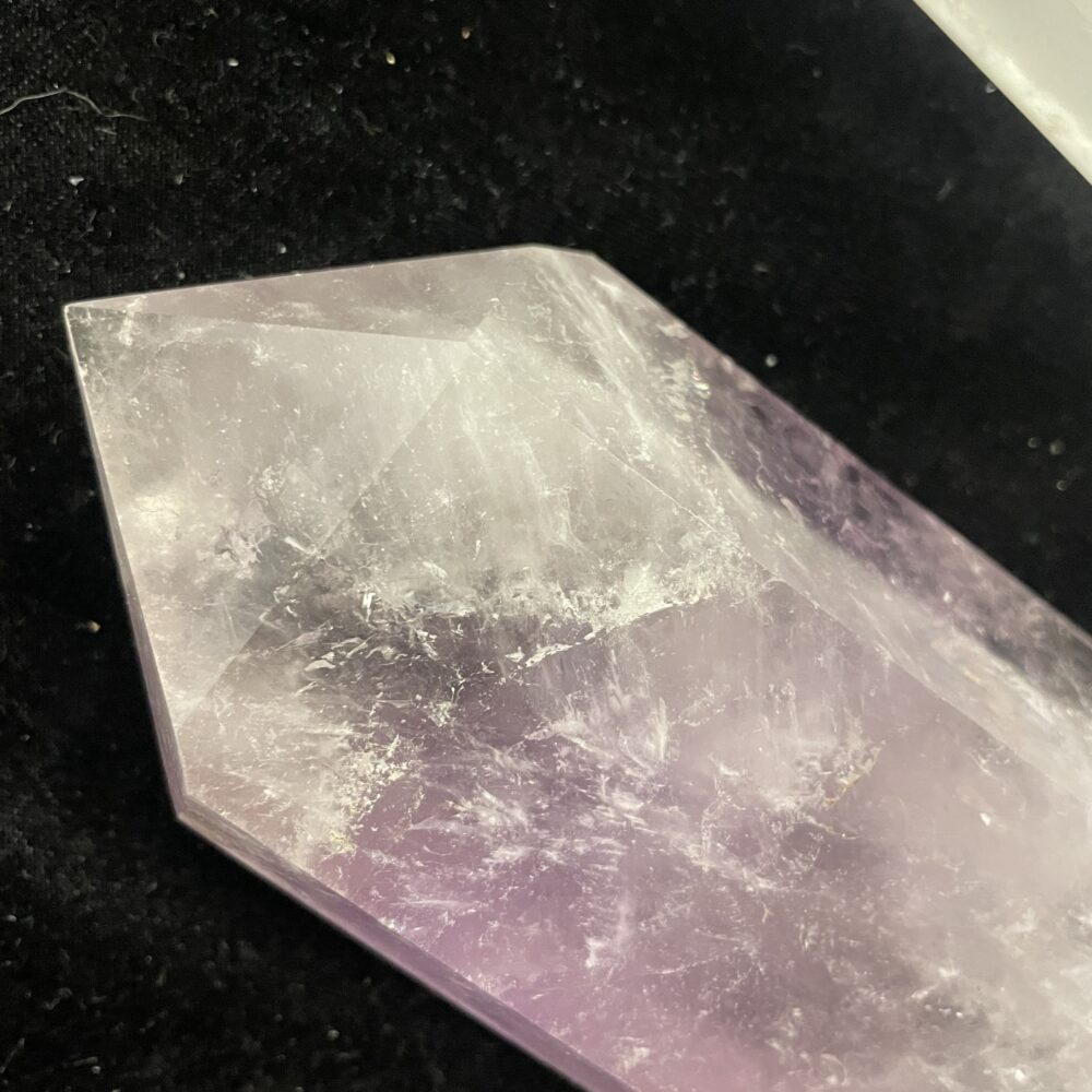 Close-up of the Rare 15.4 Inches Smoky Quartz Crystal (5 lbs 10 oz/2576g), featuring a polished, translucent form with a pointed end against a black background.