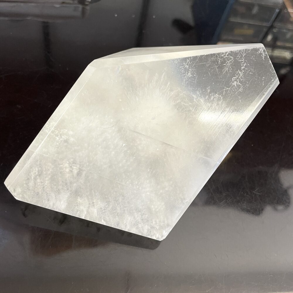 A rare Okenite in Optical Calcite from India, weighing 1 lb 4.9 oz (593g), with cloudy formations and angled edges on black.