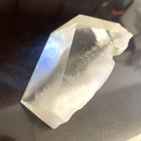 A rare Okenite inside Optical Calcite (Icelandic Spar) from India, weighing 7.5 oz (213g), sits on a dark reflective surface.